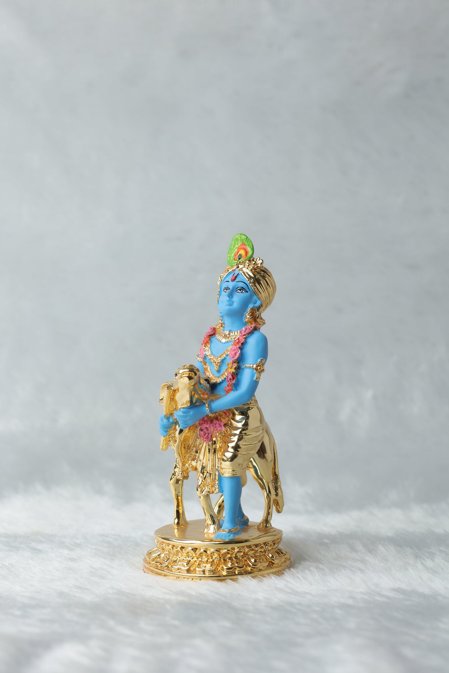 Gold plated Krishna with calf blue Colour