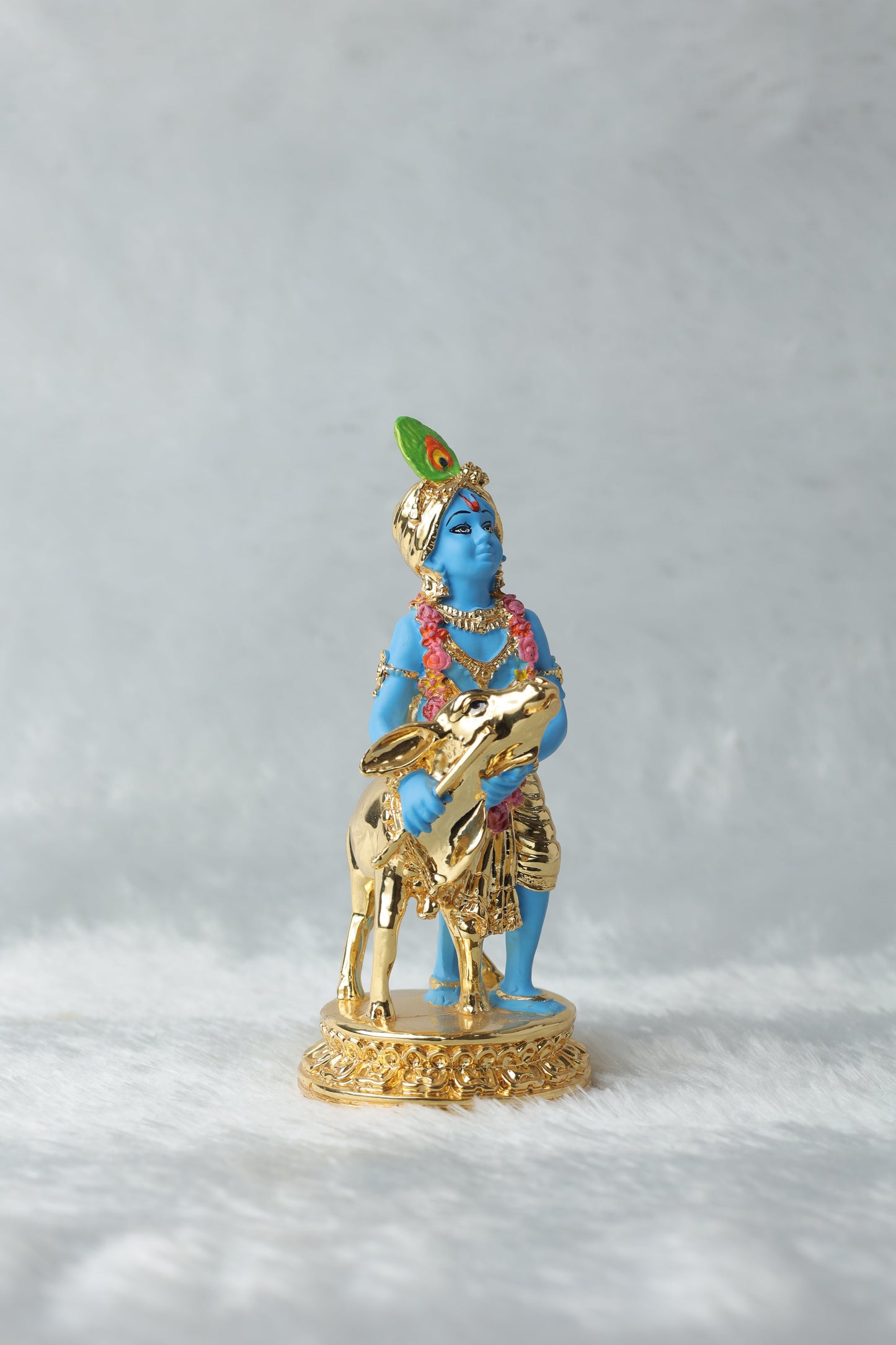 Gold plated Krishna with calf blue Colour